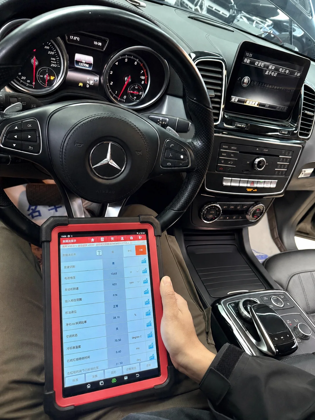 Professional third-party diagnostic check inside a vehicle
