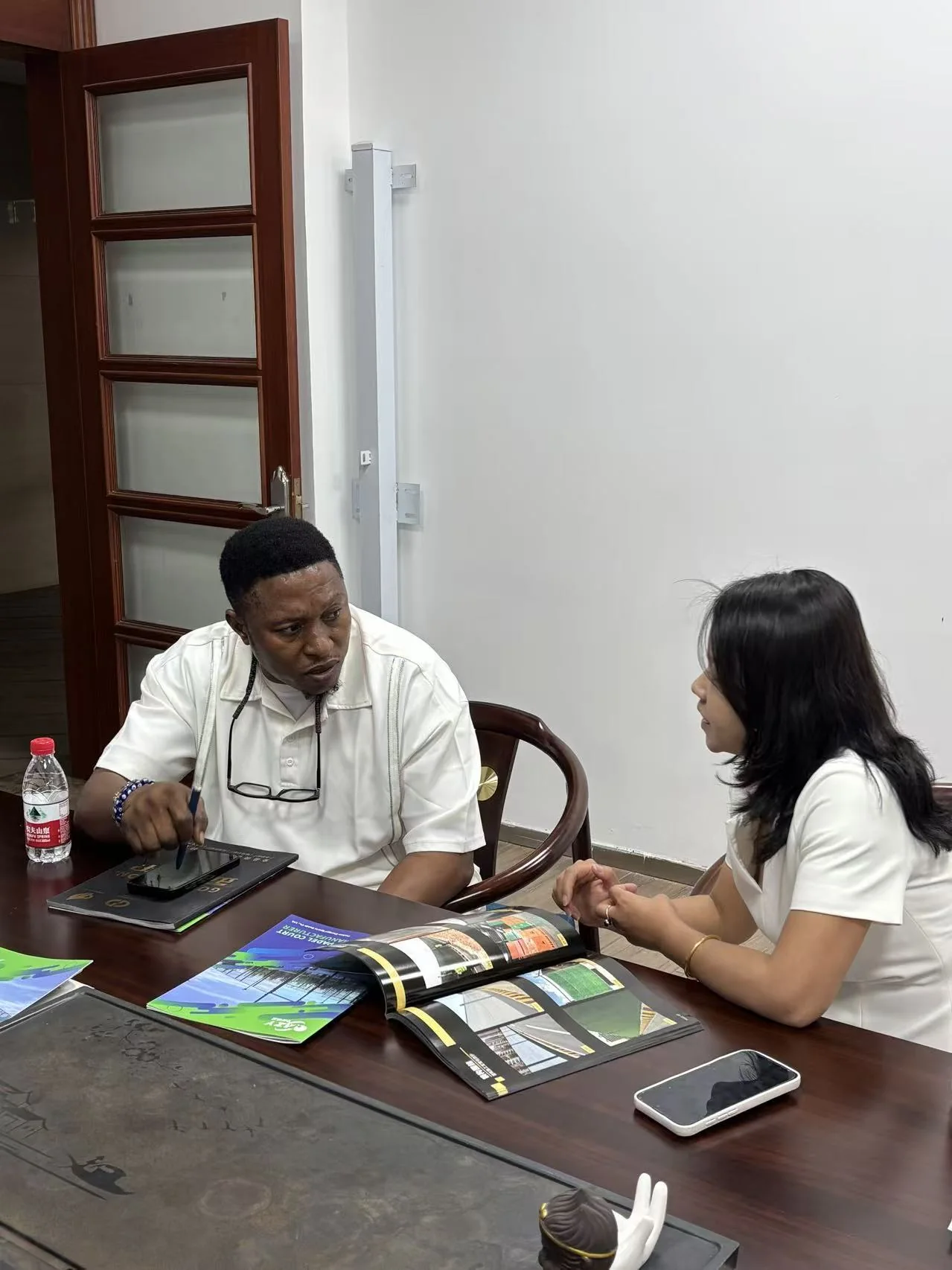 Lillian discussing sourcing requirements with an overseas client