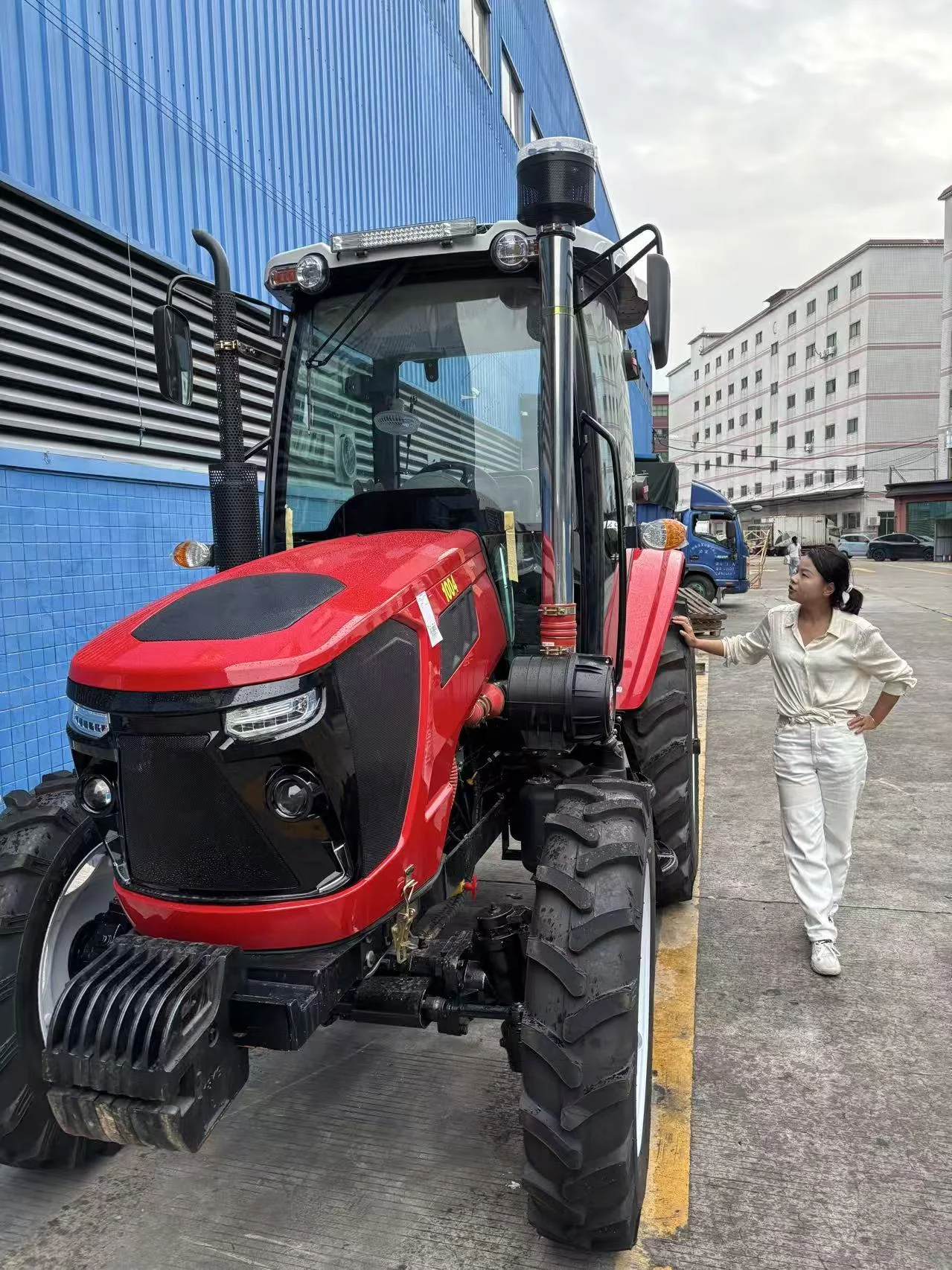 Lillian checking agricultural equipment at a China warehouse