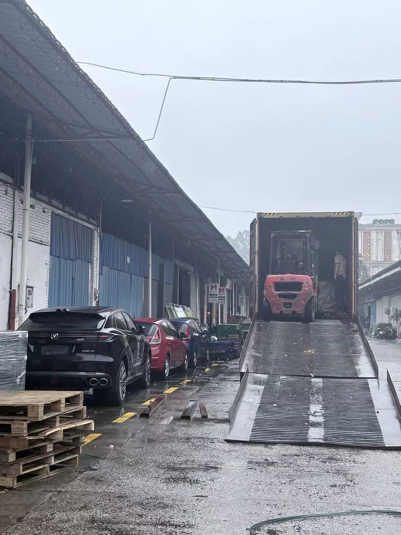 Agricultural equipment being loaded into a container at a China warehouse