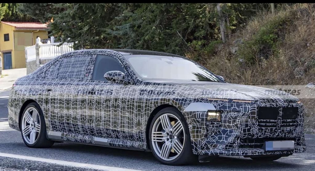 Camouflaged BMW i7 ALPINA 70 xDrive prototype in a front three-quarter view