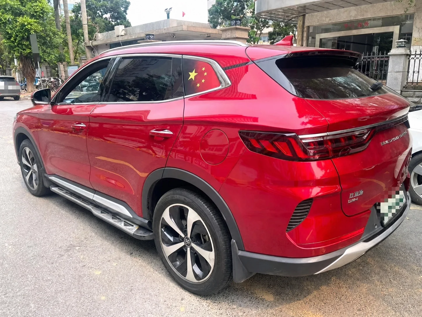 Rear three-quarter view of the inspected red BYD Song PLUS DM-i