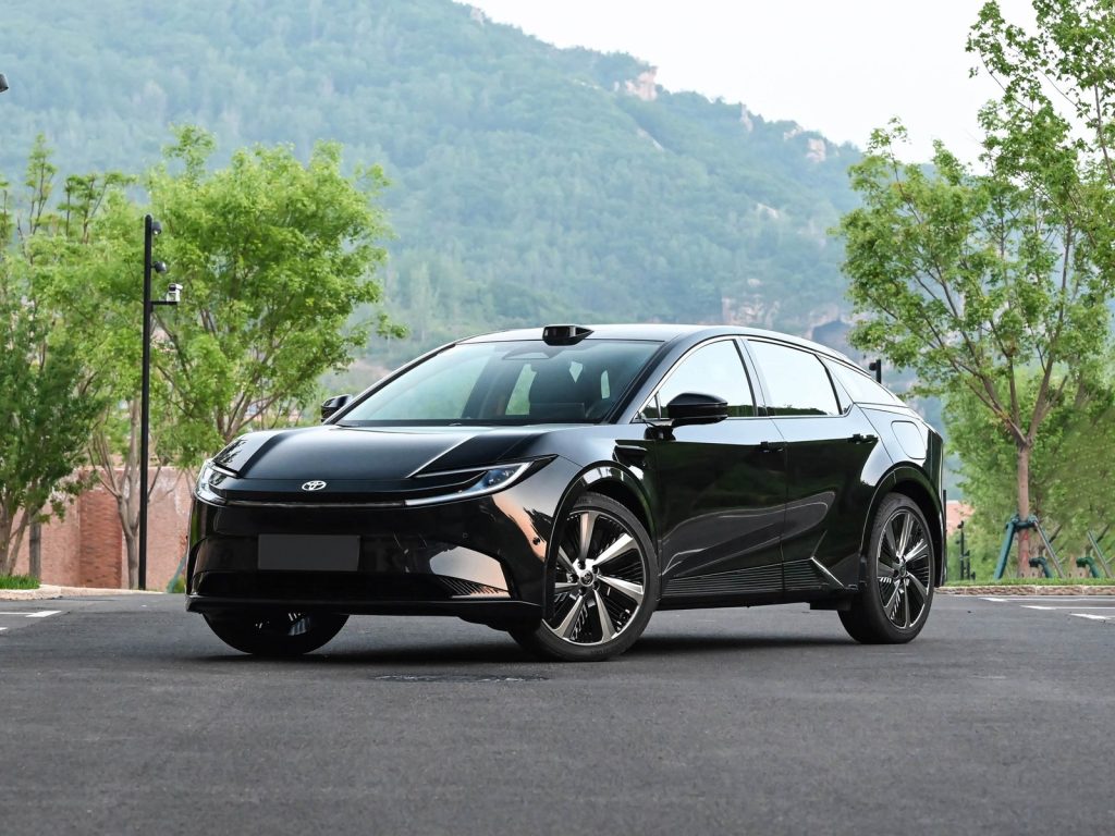 Black Toyota bZ5 electric midsize SUV in a front three-quarter view