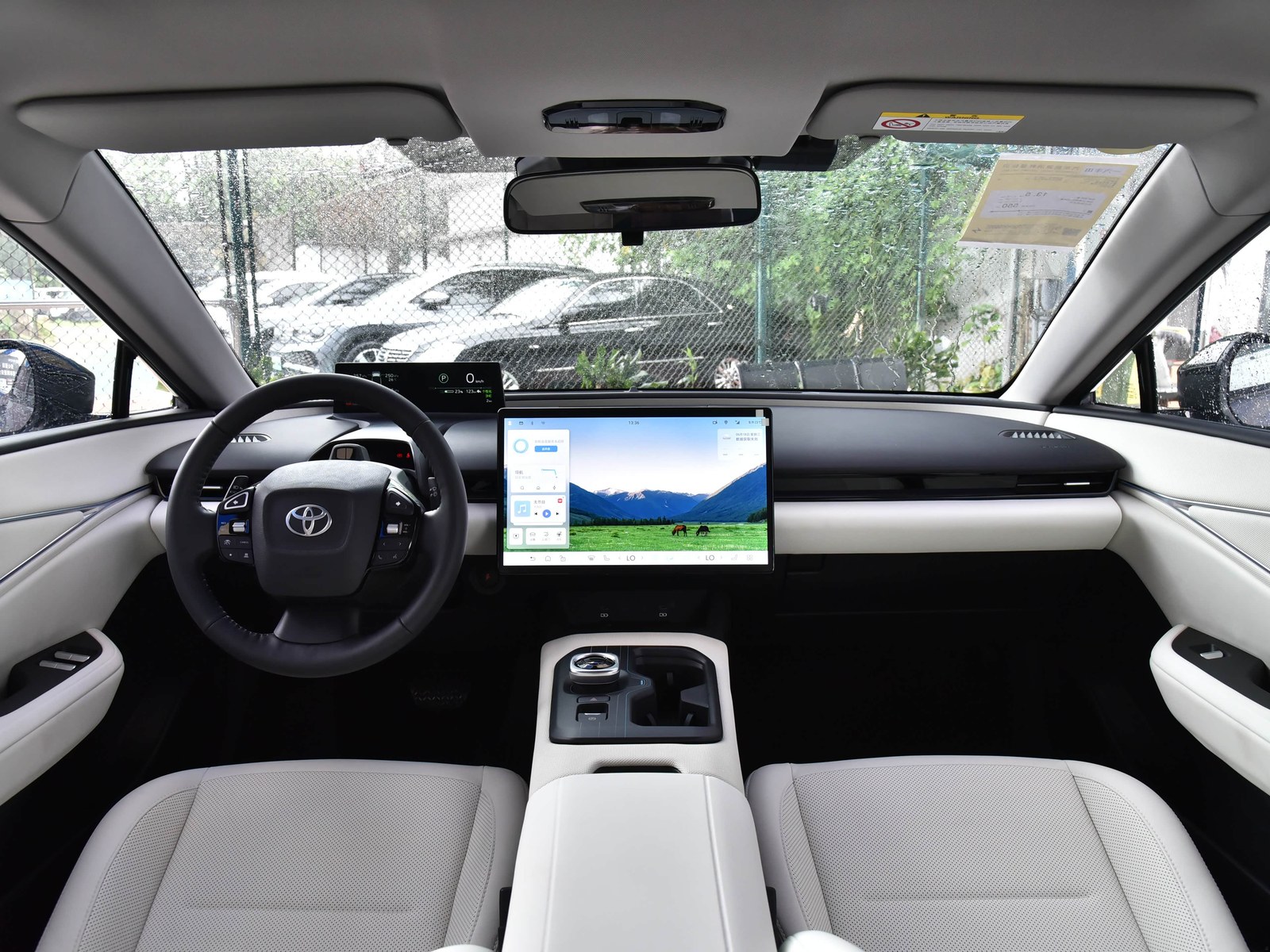 Toyota bZ5 cabin with a digital instrument display and central touchscreen