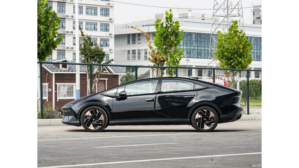 Black Hyundai IONIQ V electric sedan shown in side profile