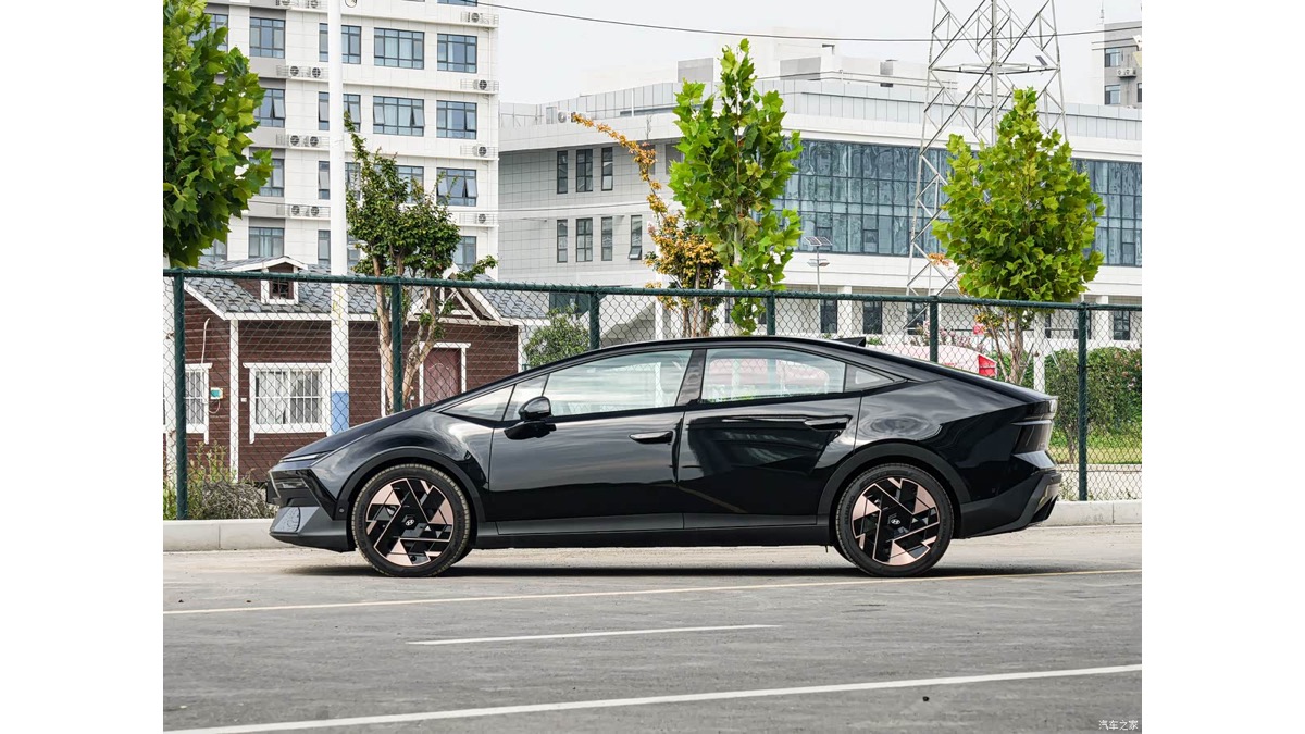 Black Hyundai IONIQ V electric sedan shown in side profile