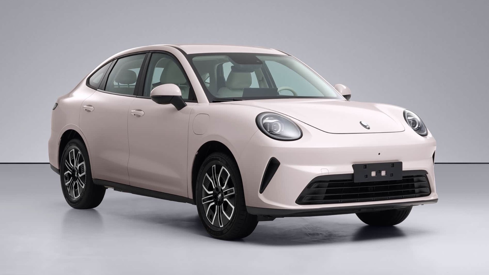 Pink GWM Ora 5 electric sedan shown from the front three-quarter angle