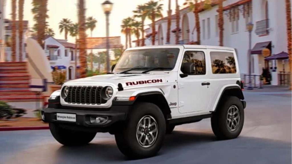 White two-door Jeep Wrangler Rubicon Final Edition driving on a city street