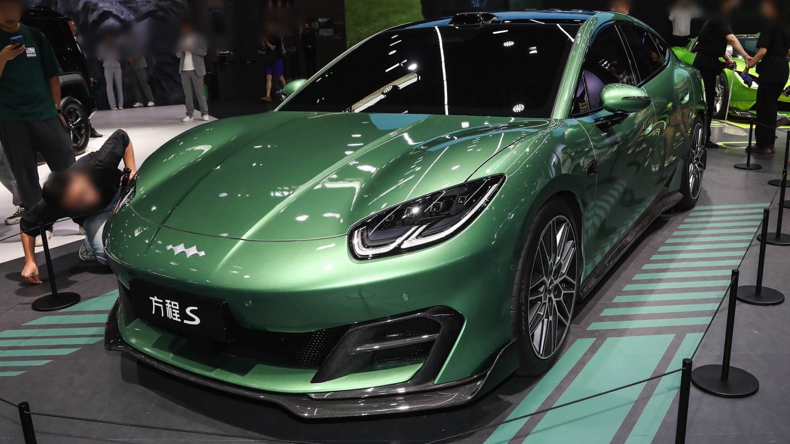 Green Fangchengbao Formula S displayed at an auto show