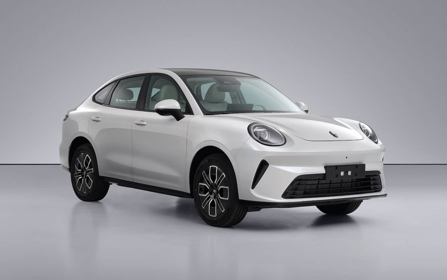 White gasoline-powered GWM Ora 5 sedan shown from the front three-quarter angle