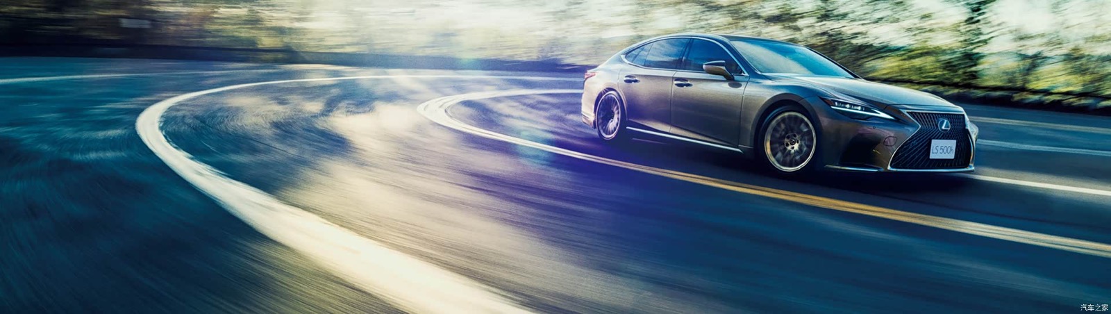 Updated Lexus LS 500h driving on a winding road