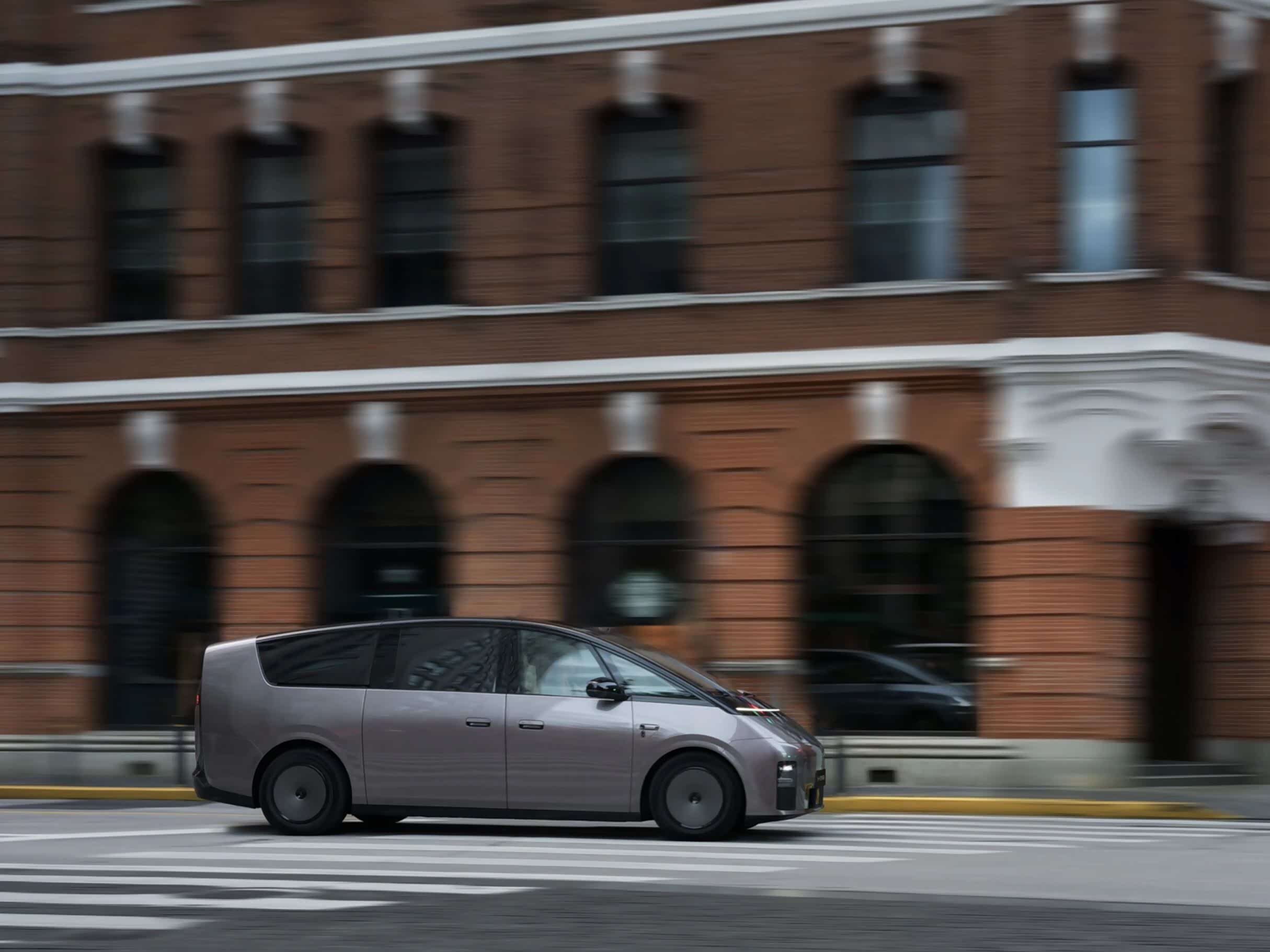 Amethyst Gray Li Auto MEGA electric MPV driving in a side view