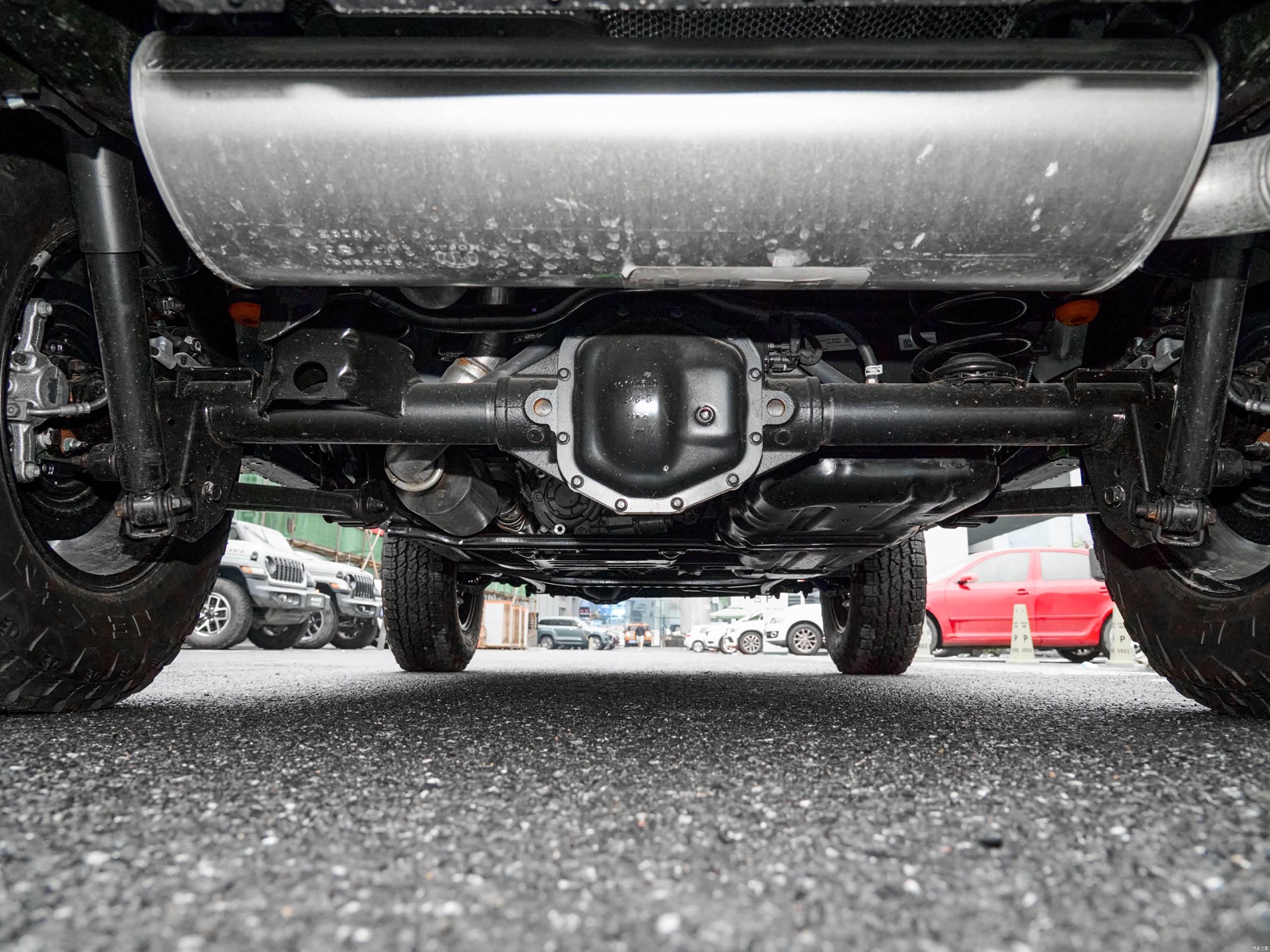 Rear axle and suspension hardware beneath a Jeep Wrangler Rubicon