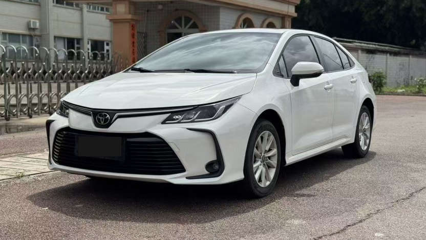 White Toyota Corolla viewed from the front three-quarter angle
