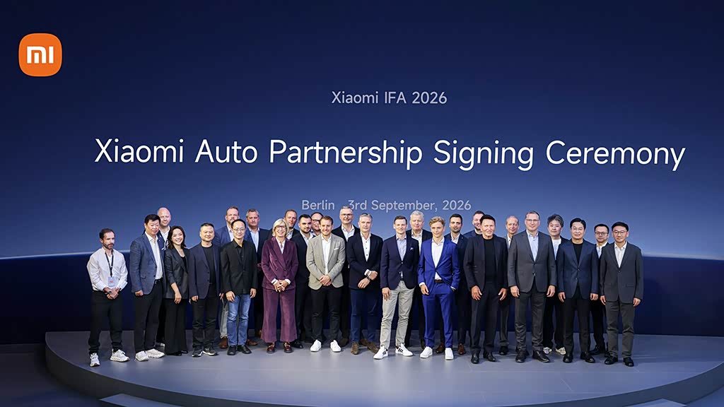 Xiaomi Auto representatives and German dealer partners at the IFA 2026 signing ceremony