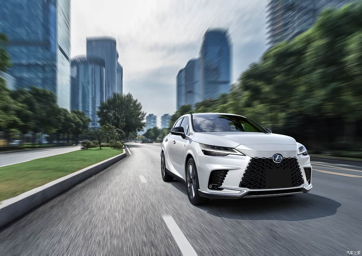 White 2027 Lexus RX shown from the front while driving