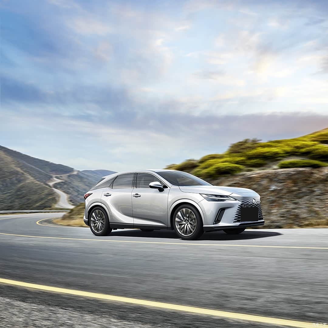 White 2027 Lexus RX in profile on a mountain road